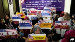 Afghan refugees hold an indoor rally in Islamabad, Pakistan, on July 21, 2023, to demand their U.S. visas be processed. Many Afghans in Pakistan awaiting special immigration to the United States face deportation back to Afghanistan.
