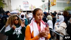 Pro-Palestinian student protesters and activists demonstrate outside the gates at Columbia University in New York, April 30, 2024.
