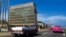 FILE - Tourists in classic cars pass the U.S. Embassy in Havana, Oct. 3, 2017. A Senate report on Dec. 27, 2024, criticized the CIA's response to Havana syndrome health problems. 