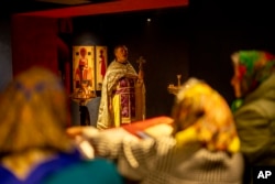 Christian Orthodox priest Hennadii Kharkivskyi leads a service at the chapel basement of the Church of the Intercession of the Blessed Virgin Mary in Lypivka near Kyiv, Ukraine, April 28, 2024.