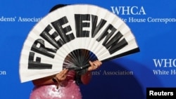 Wall Street Journal reporter Nancy Youssef calls for the release of her colleague, reporter Evan Gershkovich, as she arrives for the annual White House Correspondents’ Association Dinner in Washington, April 27, 2024.