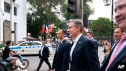 U.S. Secretary of State Blinken, accompanied by Ambassador of the United States to Vietnam Marc Knapper, right, walks to Binh Minh Jazz Club in Hanoi, Vietnam, April 15, 2023.