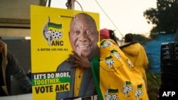 African National Congress (ANC) polling agents set up a tent decorated with party paraphernalia outside a polling station in Umlazi on May 29, 2024, during South Africas general election. 