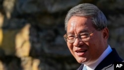 Chinese Premier Li Qiang reacts during a visit to Adelaide Zoo, Australia, June 16, 2024.