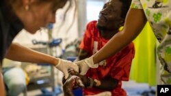 Jean Marc Baptiste is treated for a bullet wound at a Doctors Without Borders emergency room in the Cite Soleil neighborhood of Port-au-Prince, Haiti, April 19, 2024.