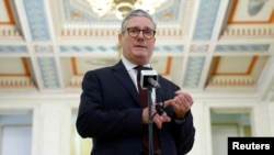 British Prime Minister Keir Starmer speaks to media at the Stormont Parliament Buildings, in Belfast, Northern Ireland, July 8, 2024. 