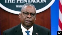 FILE - Defense Secretary Lloyd Austin speaks at a virtual Ukraine Defense Contact Group meeting, Nov. 22, 2023, at the Pentagon. Austin will participate virtually in another such session Feb. 14, 2024, after canceling plans to fly to Brussels.