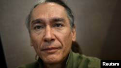 Kim Aris, the son of Myanmar’s detained former leader Aung San Suu Kyi, poses for a portrait at the Reuters office in London, Britain, Aug. 2, 2023.