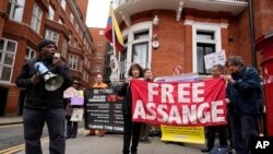 Protesters rally outside the Ecuadorian Embassy in London, April 11, 2024, where Wikileaks founder Julian Assange was arrested five years ago. U.S. President Joe Biden said that he is considering a request from Australia to drop the decade-long U.S. push to prosecute Assange.