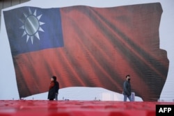 Gambar bendera Taiwan selama kampanye partai oposisi utama Kuomintang (KMT) menjelang pemilihan presiden, di New Taipei City pada 12 Januari 2024. (Foto: AFP)