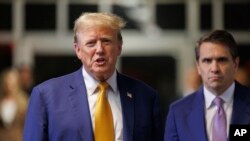 Former President Donald Trump, with his attorney Todd Blanche, speaks to reporters following the day's proceedings in his trial, May 7, 2024, in New York.