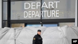 A police officer patrols at the Vatry airport, eastern France, Saturday, Dec. 23, 2023, in Vatry, eastern France. 