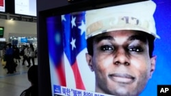 FILE - A TV screen shows a file image of American soldier Travis King during a news program at the Seoul Railway Station in Seoul, South Korea, Sept. 27, 2023. 