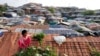 A Rohingya girl collects leaves from a vegetable plant in the Balukhali refugee camp in Cox’s Bazar, Bangladesh, on Aug 28, 2023. Over 1.2 million Rohingya refugees live in Bangladesh since fleeing violence and persecution in Myanmar. (Noor Hossain for VOA)