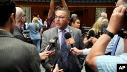 Arizona House Minority Leader Lupe Contreras, D-Cashion, answers a question after a vote on the proposed repeal of Arizona's near-total ban on abortions won approval from the House, April 24, 2024, in Phoenix.