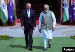 Australian Prime Minister Anthony Albanese and his Indian counterpart Narendra Modi arrive to attend a photo opportunity ahead of their meeting at Hyderabad House in New Delhi, India, March 10, 2023.