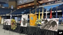 In this photo provided by the Navajo Nation Office of the President and Vice President, images of Peterson Zah are displayed at a public memorial for him on March 11, 2023, in Fort Defiance, Ariz.