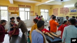 FILE - People suffering from heat related ailments crowd the district hospital in Ballia, Uttar Pradesh state, India, June 20, 2023. 