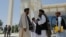 FILE - Taliban members are seen at Kabul University in Kabul, Afghanistan, June 14, 2023.