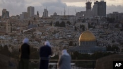 Muslim women visit the Mount of Olives, overlooking the Dome of the Rock at the Al Aqsa Mosque compound in the Old City of Jerusalem, March 7, 2024.