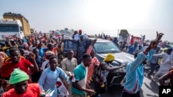 Rabi'u Musa Kwankwaso, presidential candidate of the New Nigerian Peoples Party, greets his supporters during a final election campaign rally in Kano Nigeria, Feb. 23, 2023. 