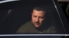 Ukraine's President Volodymyr Zelenskyy is seen in a car during a visit at a military air base in Soesterberg, Netherlands, May 4, 2023. 