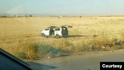 A suspected Turkish drone hit this car carrying a journalist in northeast Syria near the Kurdish city of Qamishli on Aug. 23, 2023. The attack killed the driver and severely injured the journalist. The photo was provided to VOA by a journalist who asked not to be identified.