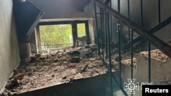 The interior of a damaged building is seen in the aftermath of a Russian drone strike, in a location given as Izmail, Ukraine, in this handout image released on July 24, 2024. (State Emergency Service of Ukraine/Handout via Reuters)