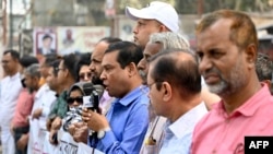 Journalists of the Dainik Dinkal publication hold a rally to protest against the government's order to halt its production in Dhaka, Bangladesh, Feb. 20, 2023.