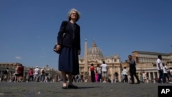 Sister Nathalie Becquart, the first female undersecretary in the Vatican's Synod of Bishops, poses for a photo in front of St. Peter's Square in Vatican City, May 29, 2023. 