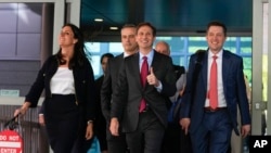 Attorney's representing Dominion Voting Systems, leave the New Castle County Courthouse in Wilmington, Del., after the defamation lawsuit by Dominion Voting Systems against Fox News was settled just as the jury trial was set to begin, April 18, 2023.