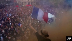 FILE - People gather at Republique plaza in Paris in a protest against the far right, July 3, 2024.