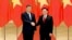 FILE - Chinese President Xi Jinping, left, and Vietnamese Chairman of the National Assembly Vuong Dinh Hue pose for a photo at the national assembly in Hanoi, Vietnam, Dec. 13, 2023.