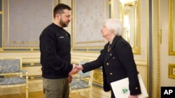 Ukrainian President Volodymyr Zelenskyy, left, and U.S. Treasury Secretary Janet Yellen shake hands during their meeting in Kyiv, Ukraine, Feb. 27, 2023.