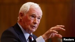 FILE - David Johnston, special rapporteur on foreign interference, holds a press conference about his findings and recommendations, in Ottawa, Ontario, Canada, May 23, 2023. Johnston will leave his post by the end of June.