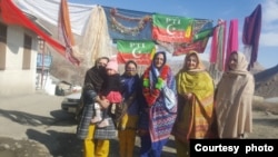 In this undated photo, Suriya Bibi poses with supporters in Chitral, Pakistan. (Photo courtesy of Azhar Uddin)