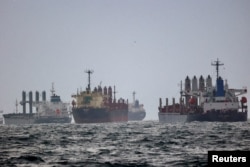 FILE - Vessels await inspection under the Black Sea Grain Initiative, brokered by the United Nations and Turkey, in the southern anchorage of the Bosphorus in Istanbul, Turkey, Dec. 11, 2022.