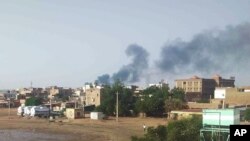 Smoke rises over Khartoum, Sudan, June 23, 2023. Clashes between warring factions resumed in Sudan's capital and a neighboring city after a three-day cease-fire expired.