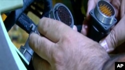 This frame grab from video footage released Aug. 31, 2023, by Iranian state television's IRINN network shows what officials described as faulty foreign parts that could be used in a missile or a drone.