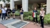 Iranian Americans protest outside Iran’s interests section office in Washington, June 28, 2024, as it hosts an absentee voter ballot station for the first round of the Iranian presidential election.