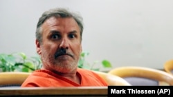 In this Oct. 16, 2019, file photo, Brian Steven Smith looks out in the courtroom while waiting for his arraignment to start in Anchorage, Alaska.