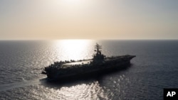 FILE - The USS aircraft carrier Dwight D. Eisenhower sails in the Red Sea on June 12, 2024.