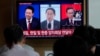 A TV screen shows file images of South Korean President Yoon Suk Yeol, left, Japanese Prime Minister Fumio Kishida and Chinese Premier Li Qiang, right, during a news program at the Seoul Railway Station in Seoul, South Korea, Thursday, May 23, 2024. 