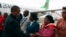 Malawi Vice President Saulos Chilima, left, greets government officials upon his return from South Korea in Lillongwe, June 9, 2024.