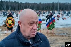 Wagner Group head Yevgeny Prigozhin attends the funeral of a fighter of the Wagner group who died fighting in Ukraine, at the Beloostrovskoye cemetery outside St. Petersburg on December 24, 2022. (AP)