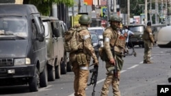 Russian servicemen guard an area in a street in Rostov-on-Don, Russia, June 24, 2023.