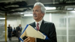 FILE - Newspaper founder Jose Ruben Zamora leaves in handcuffs after a court hearing in Guatemala City, June 14, 2023. 