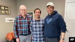 Mohammad Hussain Musawi, center, stands with his flight instructor, left, and Darin Chung, of the Afghan American Development Group, in Independence, Oregon, on April 7, 2023. Musawi and two other men died when a plane he was piloting crashed Dec. 16, 2023. (Nikki Chung via AP)