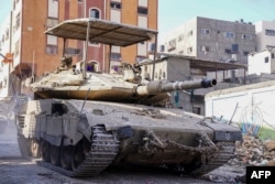 This handout picture released by the Israeli army on Dec. 18, 2023, shows an army tank during operations in the Gaza Strip, amid continuing battles between Israel and the Palestinian militant group Hamas.