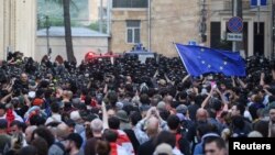 Security forces operate as demonstrators hold a rally to protest against a 'foreign influence' bill in Tbilisi, Georgia, May 1, 2024.